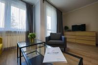 Televízia a/alebo spoločenská miestnosť v ubytovaní RentPlanet - Apartament Kościelna