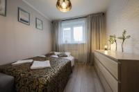 Posteľ alebo postele v izbe v ubytovaní RentPlanet - Apartament Kościelna