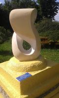 a statue of a vase sitting on top of a yellow platform at Kamp Romantik - glamping in Labin