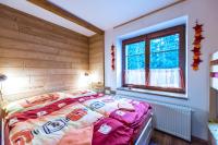 Postel nebo postele na pokoji v ubytování Apartmány Domino