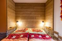 Postel nebo postele na pokoji v ubytování Apartmány Domino