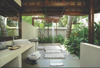 a bathroom with a sink and a mirror at Qunci Villas Resort in Senggigi