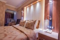Postel nebo postele na pokoji v ubytování LAUR HOTELS Experience & Elegance