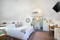 Postel nebo postele na pokoji v ubytování Punta Rucia Lodge Hotel Boutique & Spa