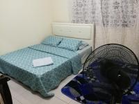 A1-04-03 Damiana Apartmentにあるベッド