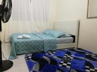 A1-04-03 Damiana Apartmentにあるベッド