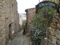 an alley with a sign that reads be rope soft tobacco at Chambre et Gite Le Roc sur l&#39;Orbieu in Carcassone