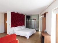 Postel nebo postele na pokoji v ubytování Hospedium Hotel Cañitas Maite Boutique
