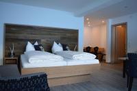 A bed or beds in a room at Haus Garni Luggi Leitner