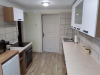 A kitchen or kitchenette at Csóka Apartman Pápa