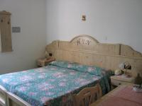 Posteľ alebo postele v izbe v ubytovaní Hotel Negritella