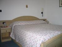 Posteľ alebo postele v izbe v ubytovaní Hotel Negritella