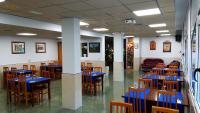 Reštaurácia alebo iné gastronomické zariadenie v ubytovaní Hotel Don Pelayo