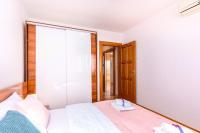Postel nebo postele na pokoji v ubytování Apartments Lulic