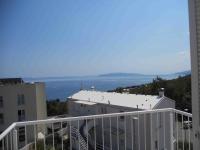 a balcony of a building with a view of the ocean at Apartman Tramontana in Opatija