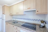 A kitchen or kitchenette at Villas Guzman - Apartamento Coral Beach