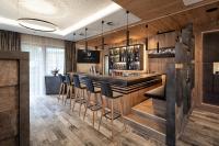 Televízia a/alebo spoločenská miestnosť v ubytovaní Hotel Modern Mountain