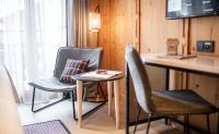 TV a/nebo společenská místnost v ubytování Tradition Julen Hotel