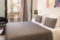 Postel nebo postele na pokoji v ubytování EasySleep Gaudi Terrace