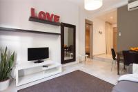 TV a/nebo společenská místnost v ubytování EasySleep Gaudi Terrace