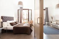 Postel nebo postele na pokoji v ubytování EasySleep Gaudi Terrace