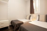 Postel nebo postele na pokoji v ubytování EasySleep Gaudi Terrace