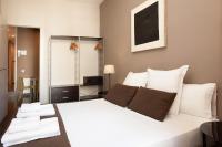 Postel nebo postele na pokoji v ubytování EasySleep Gaudi Terrace