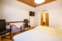 Posteľ alebo postele v izbe v ubytovaní Haus Alpenland
