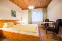 Posteľ alebo postele v izbe v ubytovaní Haus Alpenland