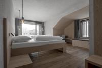 A bed or beds in a room at Hotel Krondlhof