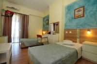 Postel nebo postele na pokoji v ubytování Socrates Hotel