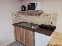Kuchyň nebo kuchyňský kout v ubytování Apartmány U Vlka