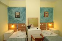 Postel nebo postele na pokoji v ubytování Socrates Hotel