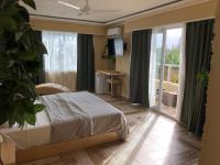 Postel nebo postele na pokoji v ubytování Sosua Inn Hotel