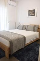 Posteľ alebo postele v izbe v ubytovaní Heliconia deluxe Apt Must