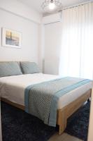 Posteľ alebo postele v izbe v ubytovaní Heliconia deluxe Apt Must