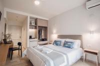 Ένα ή περισσότερα κρεβάτια σε δωμάτιο στο Iliada Beach Hotel