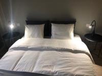 A bed or beds in a room at DISTRiCT 01-Luxury Urban Lofts