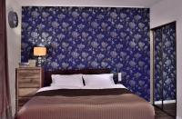 Posteľ alebo postele v izbe v ubytovaní Apartamenty Sjesta Centrum