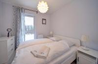Posteľ alebo postele v izbe v ubytovaní Apart-Invest Apartament Oslo