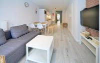 Televízia a/alebo spoločenská miestnosť v ubytovaní Apart-Invest Apartament Oslo