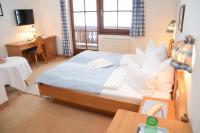 Łóżko lub łóżka w pokoju w obiekcie Seehotel Huber