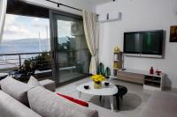 A television and/or entertainment centre at Holy Paraskevi Apartment