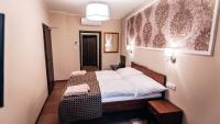 Postel nebo postele na pokoji v ubytování Star Hotel