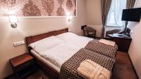 Postel nebo postele na pokoji v ubytování Star Hotel