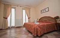 Postel nebo postele na pokoji v ubytování Hotel Aquadolce