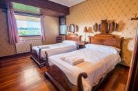 Postel nebo postele na pokoji v ubytování Azkorri Beach House