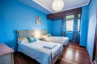 Postel nebo postele na pokoji v ubytování Azkorri Beach House