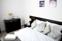 Posteľ alebo postele v izbe v ubytovaní Apartament IKAR z ogródkiem, blisko morza