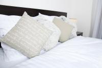 Posteľ alebo postele v izbe v ubytovaní Apartament IKAR z ogródkiem, blisko morza
